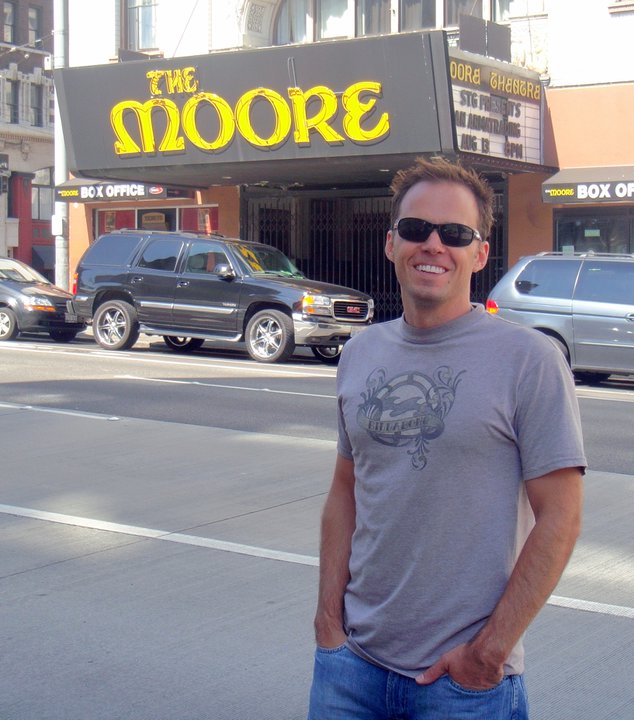 Picture of Seth J. Moore with The Moore Theatre in the background